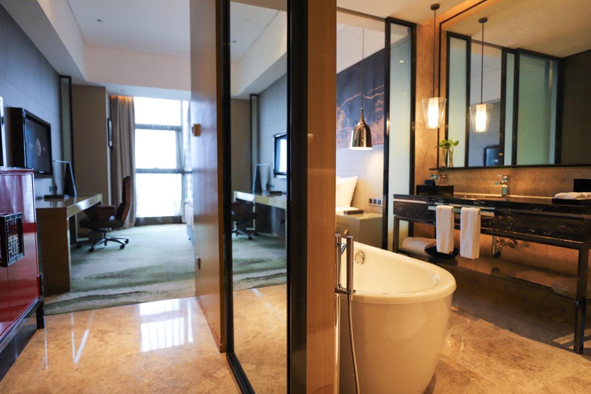 ว่านต้า เรล์ม เจียงเหมิน Hotel ภายนอก รูปภาพ